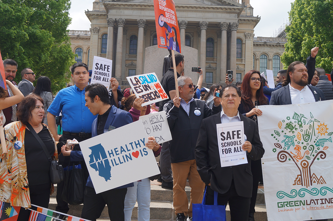 Immigrant rights advocates with signs
